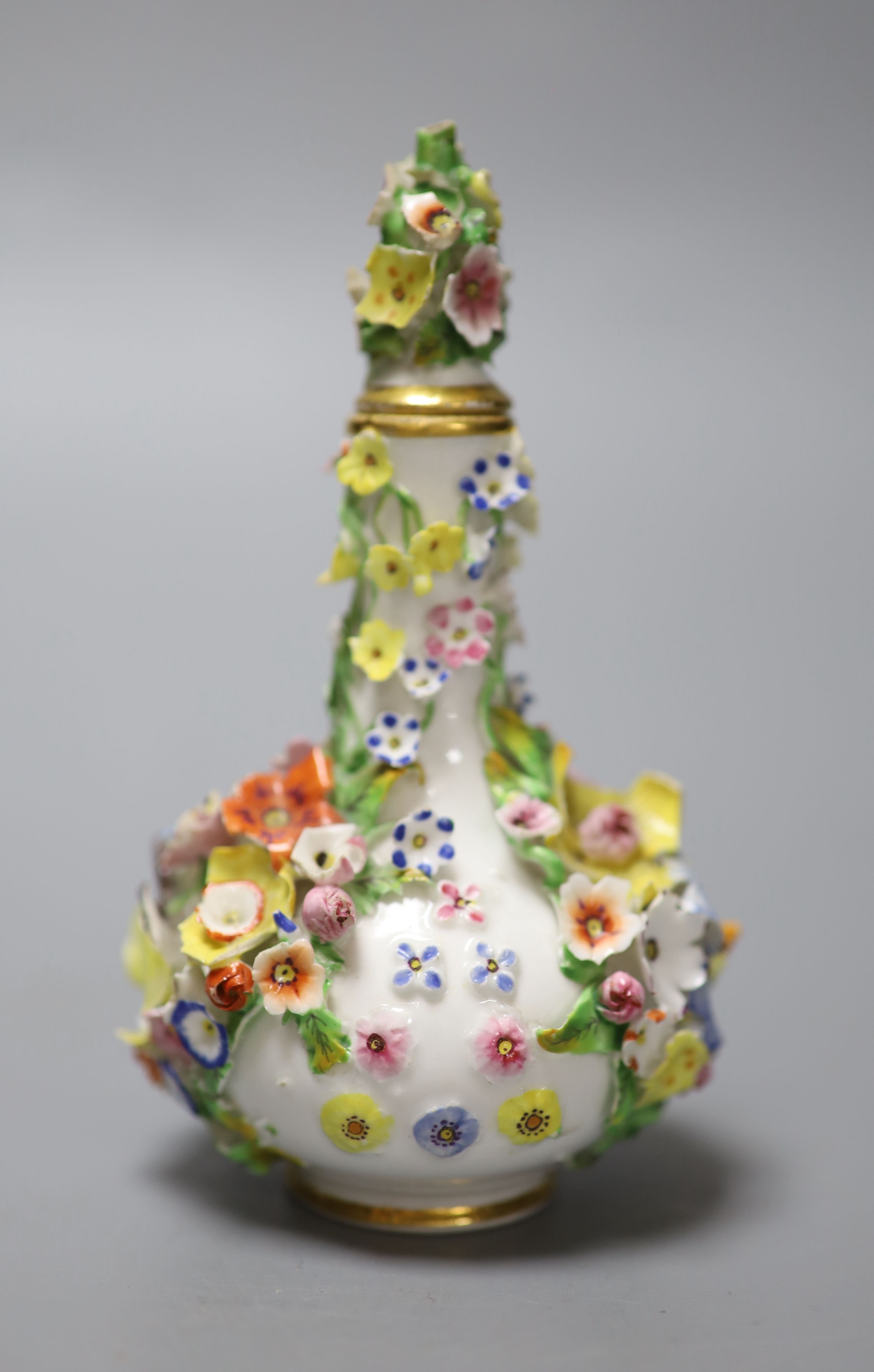 A rare mid 19th century Derby flower encrusted scent bottle, crown D mark in red, height 13cm